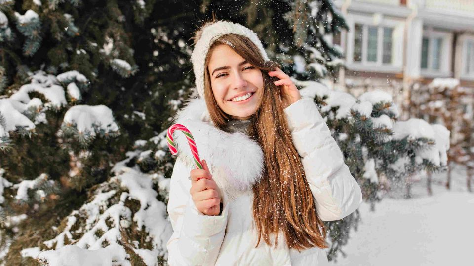 woman touching her hair in winter