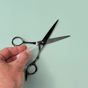 Scissor oil being applied to Leaf Scissors