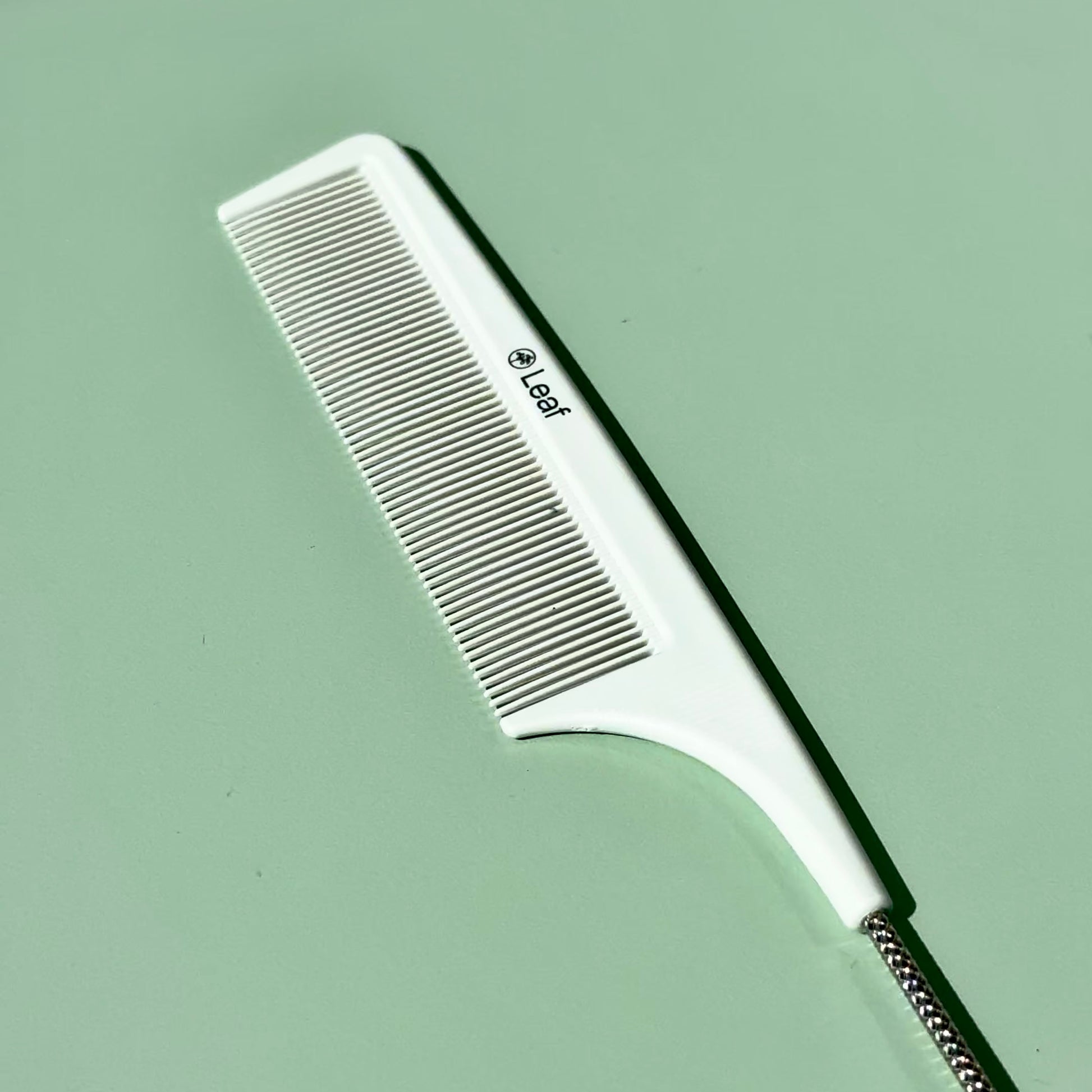 Leaf in tail hairdressing comb close up
