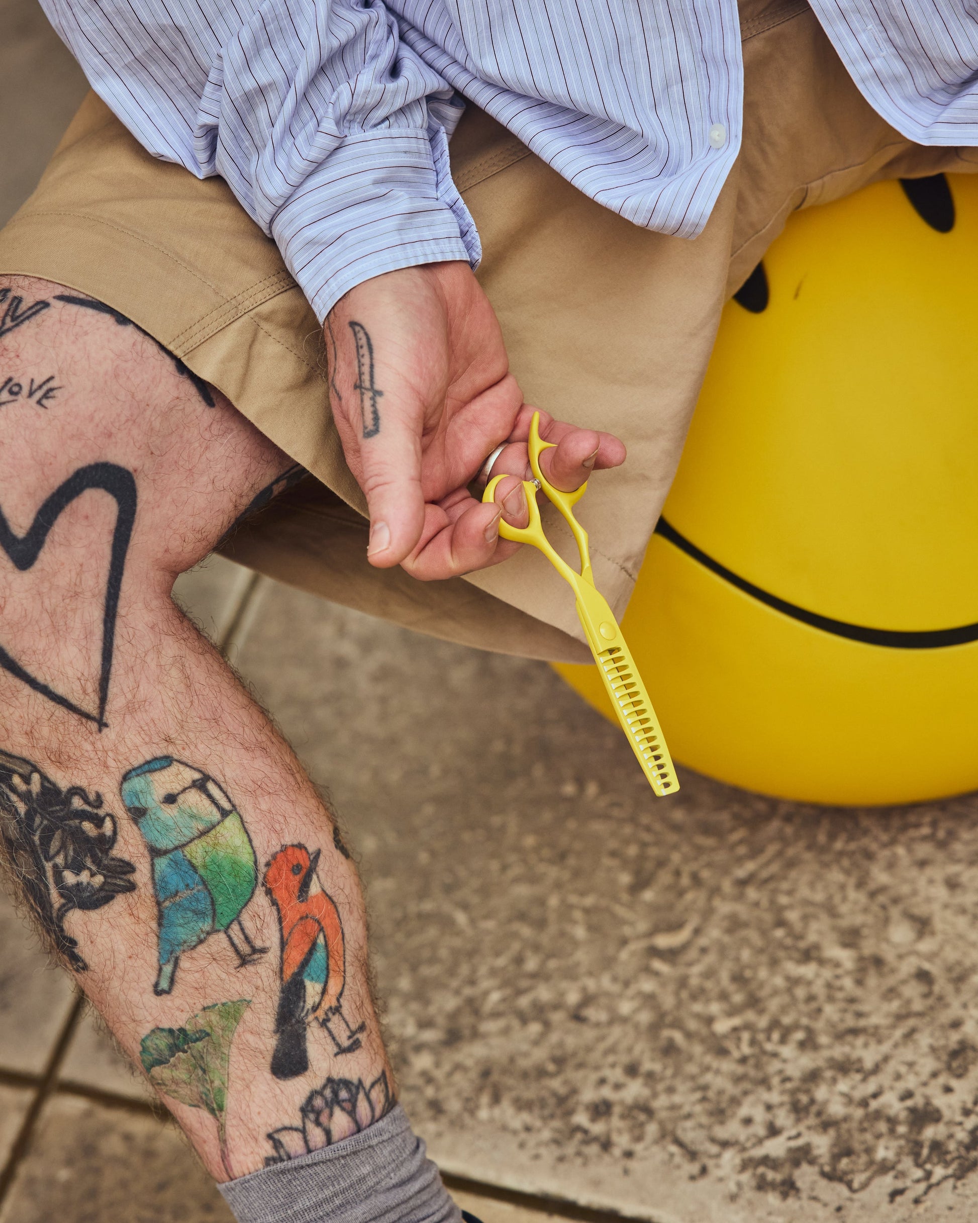 Adam Reed holding the limited-edition yellow texturising shear