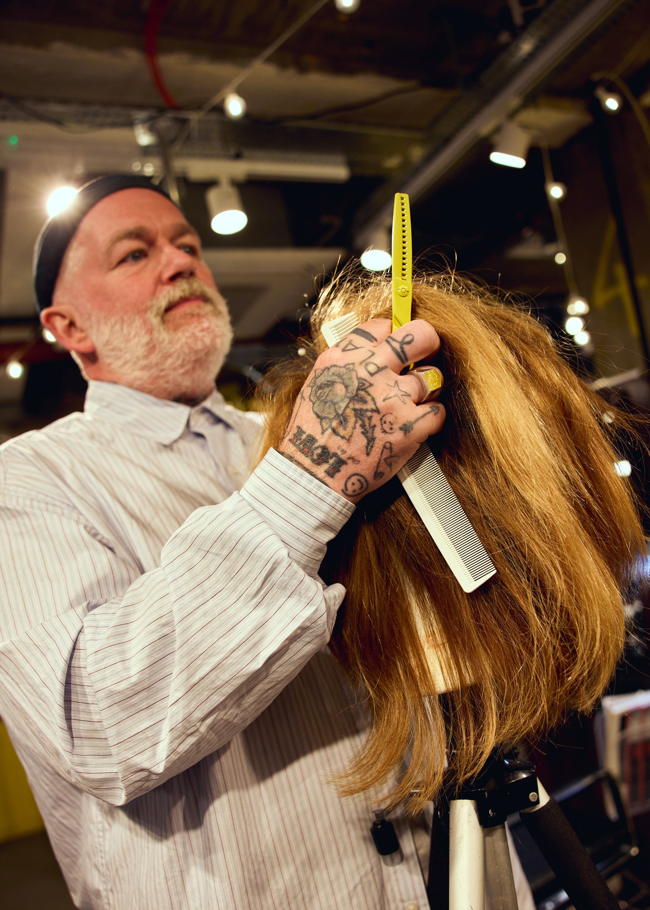 Adam Reed using the Leaf Yellow Shatter Shear during a creative haircut