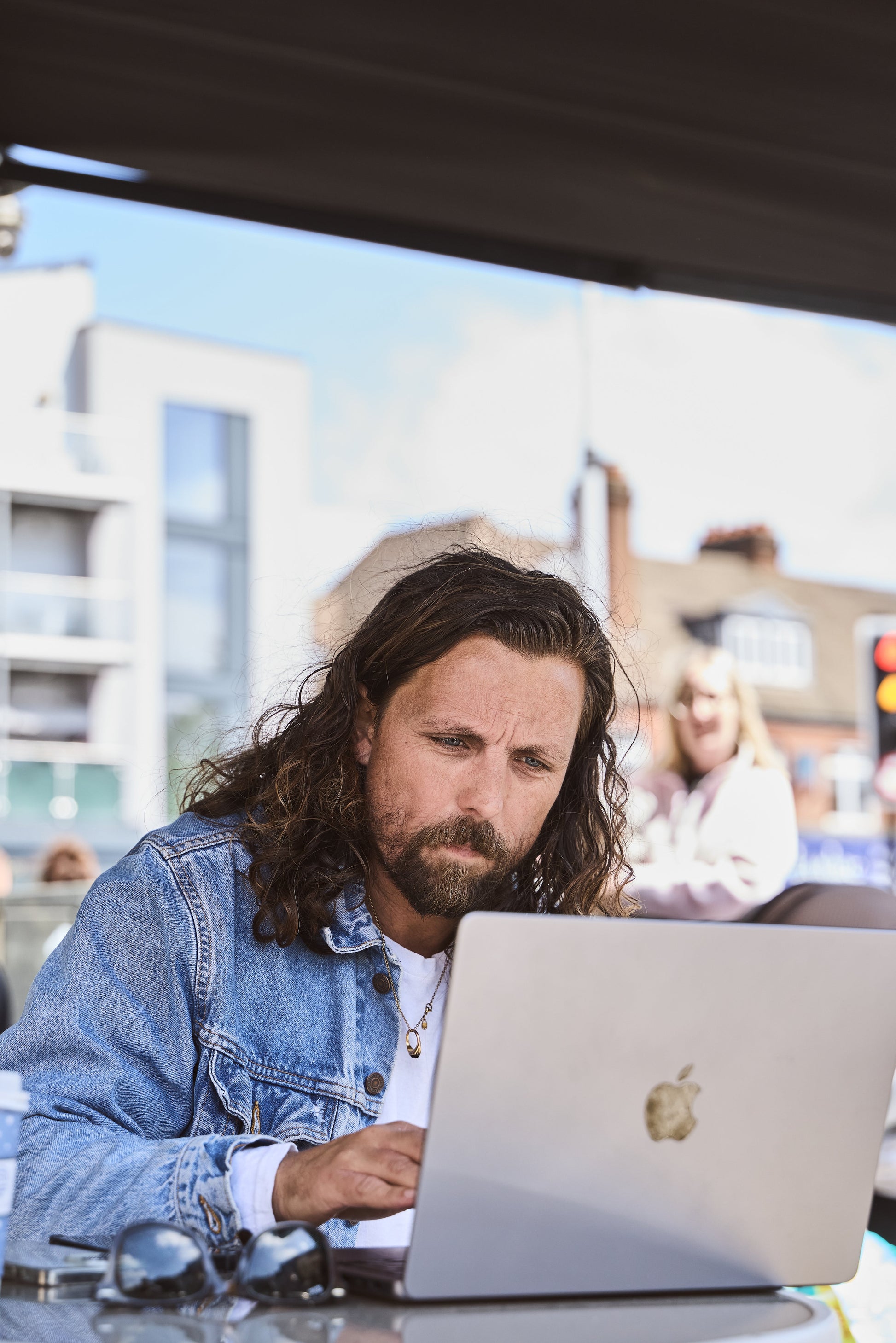 James Busby planning hairdressing content at his laptop
