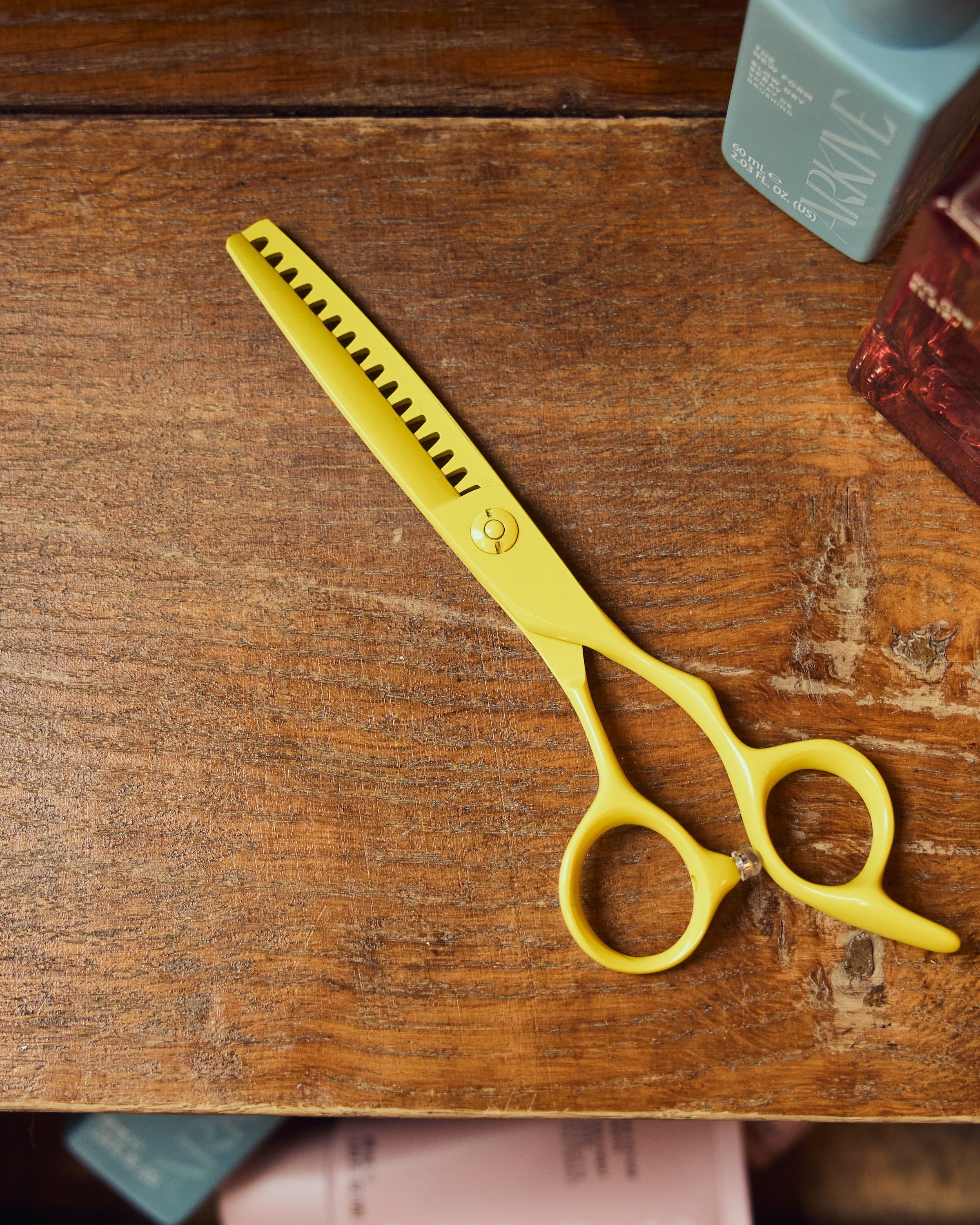 Limited-edition Leaf Yellow Shatter Shear displayed on a wooden surface